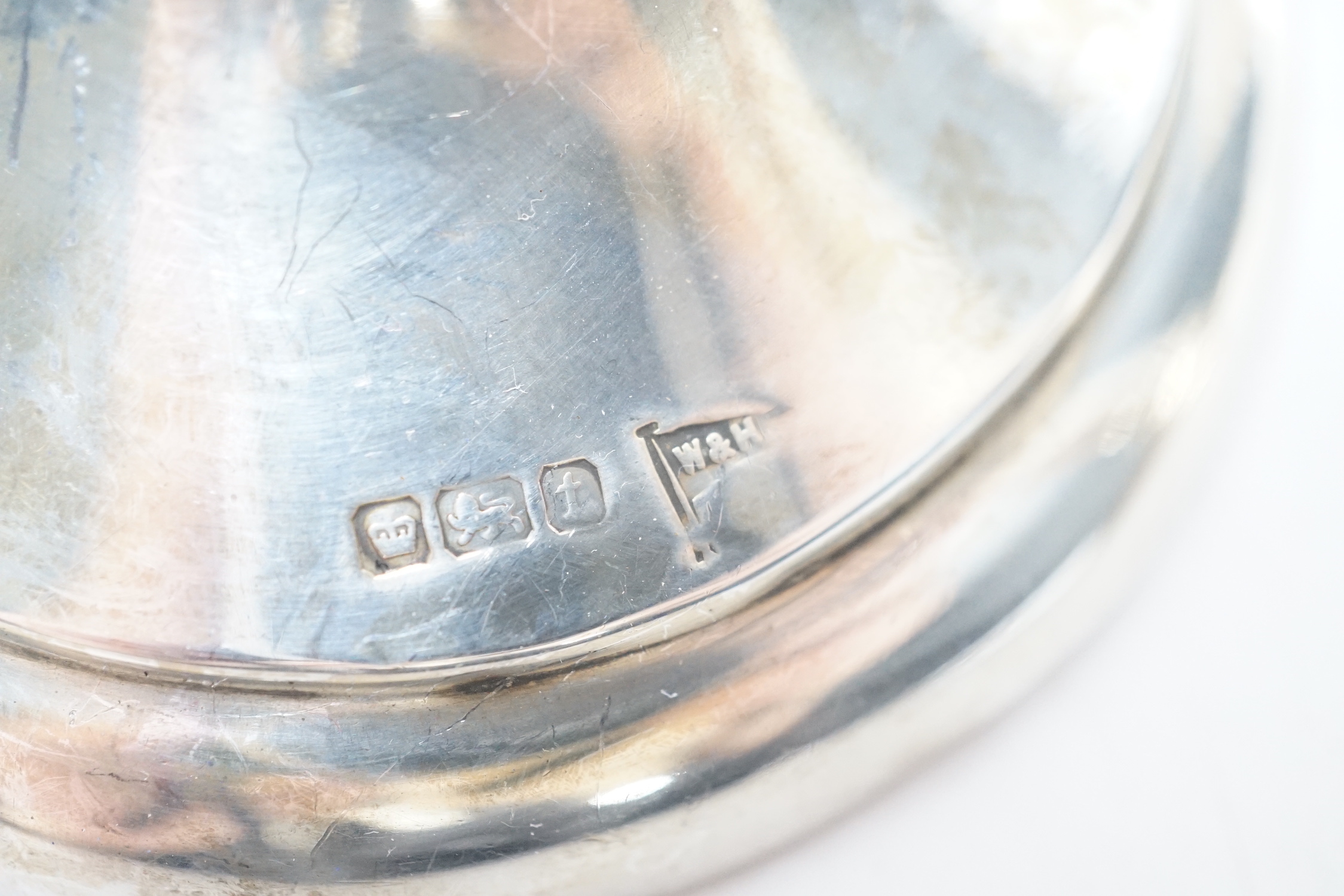 A pair of George V silver spill vases, with wavy rims, Walker & Hall, Sheffield, 1911, 27.1cm, weighted.